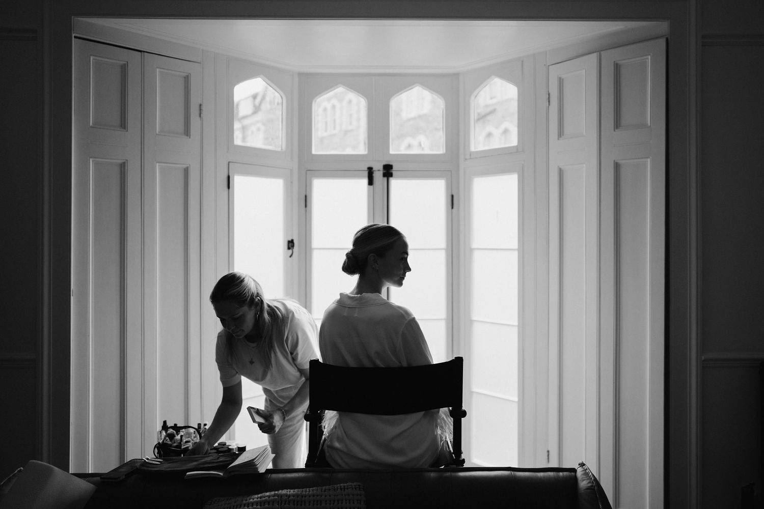 Tunnels Beach Wedding Venue in North Devon, Bride sat in chair getting make up done