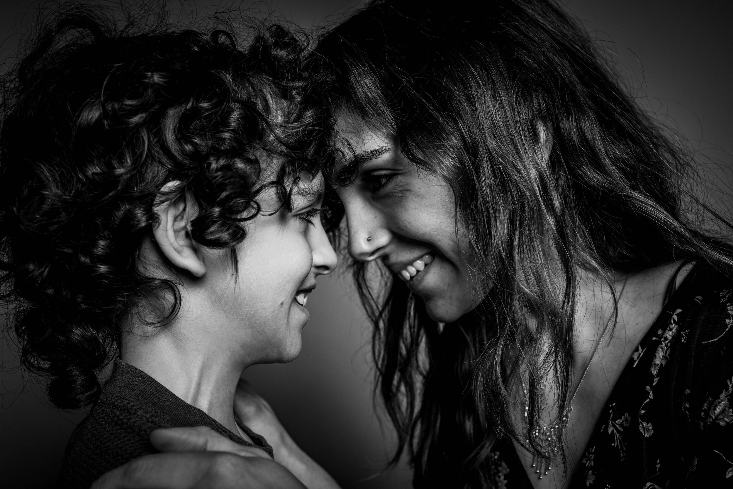 Family portrait of mom and son in black and white at my studio Aperture Insight.