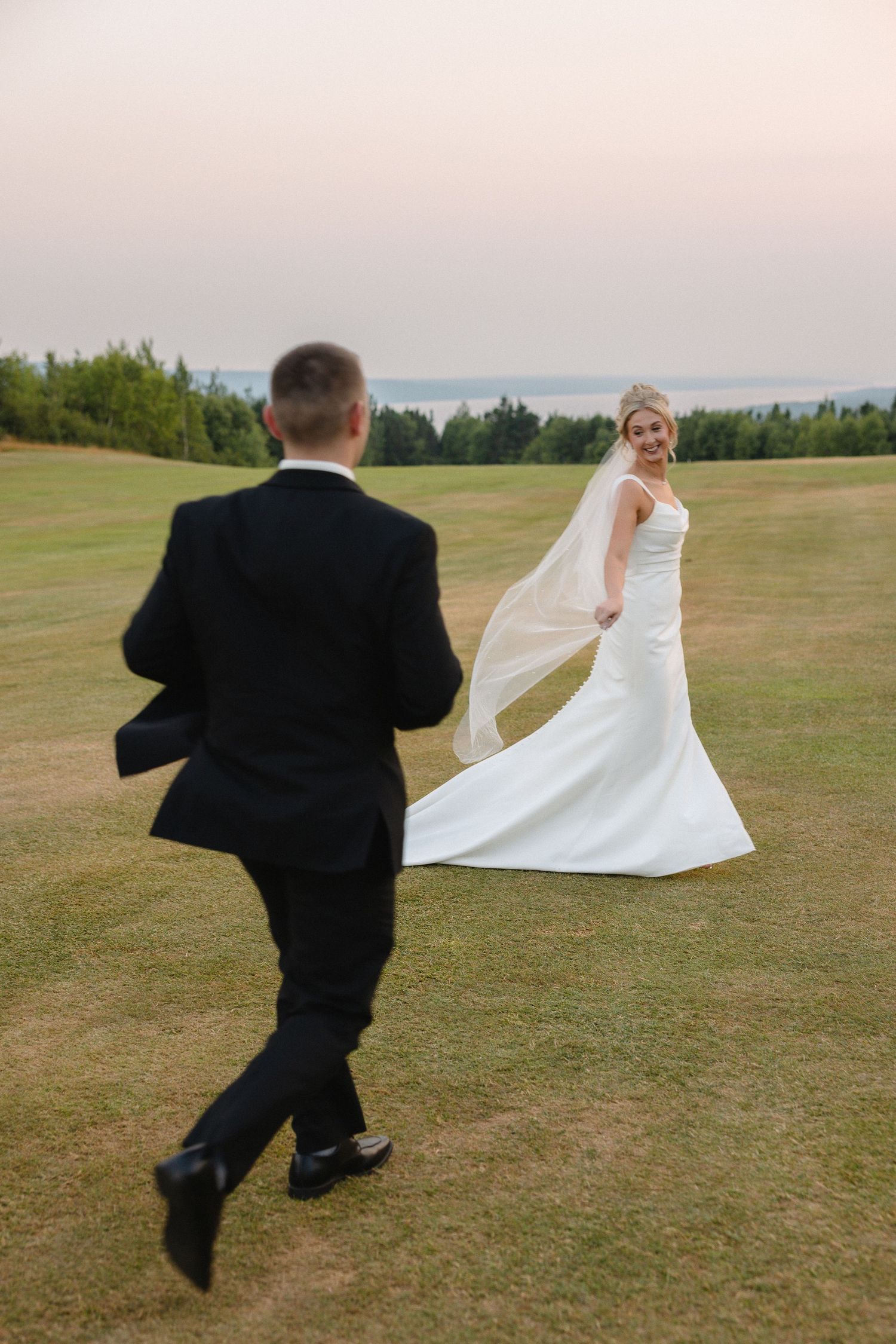Bride and Groom standing on the balcony