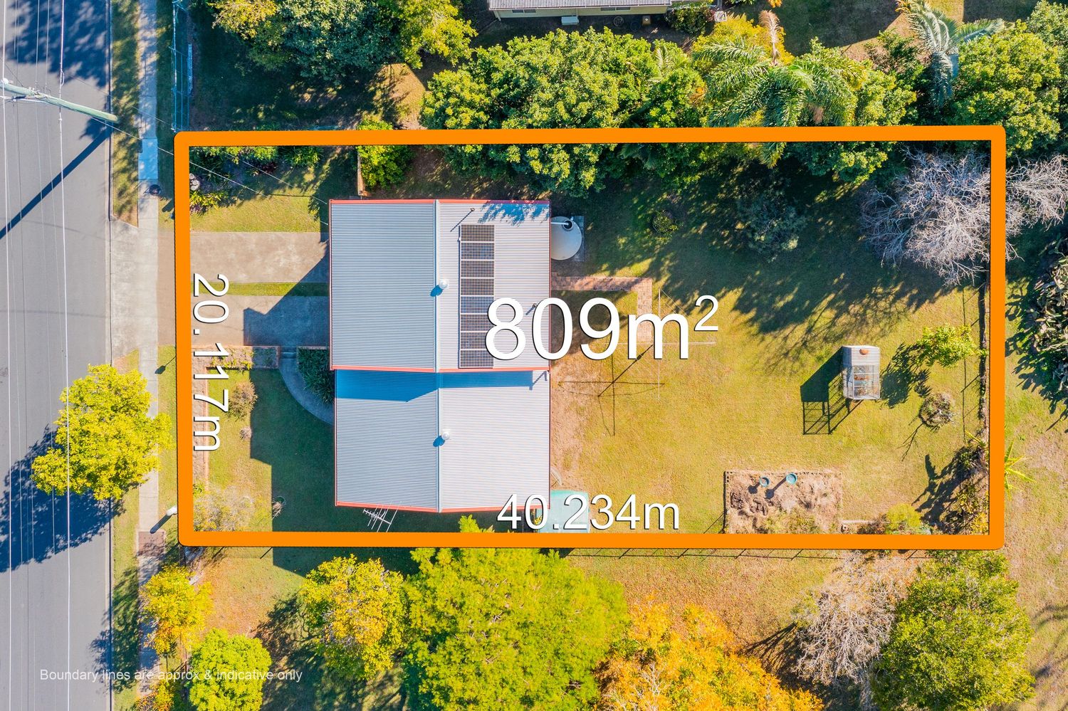 Aerial view showing 809m² property block measuring 20.17m x 40.234m with single-story home in Queensland suburb.