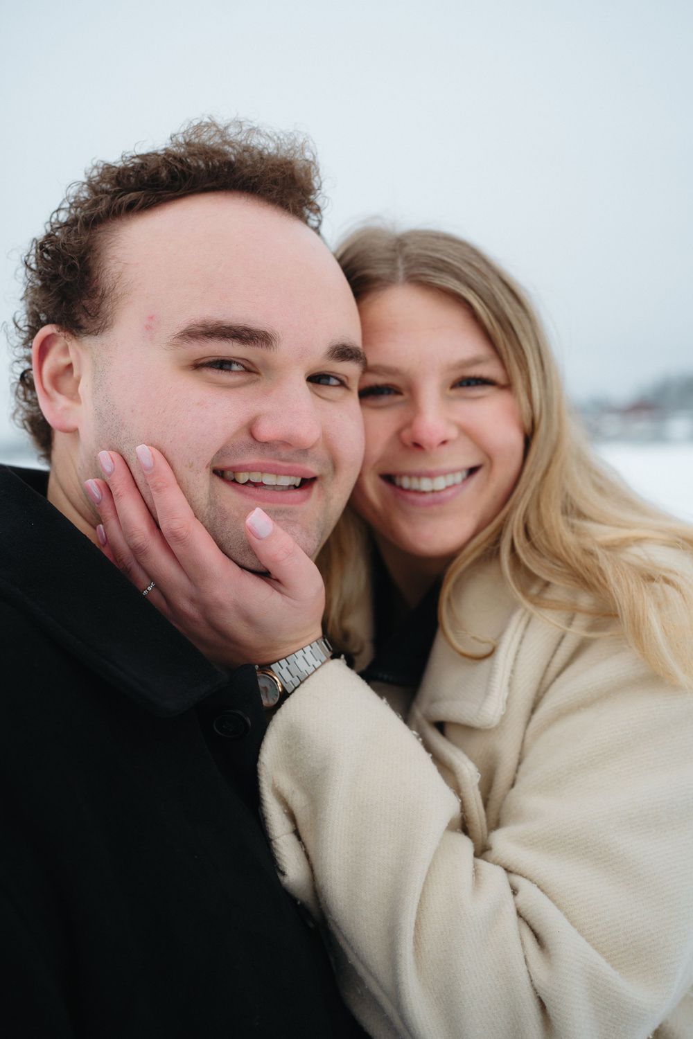 A couple shares joyful moments together in a series of close-up shots showing laughter and affection.