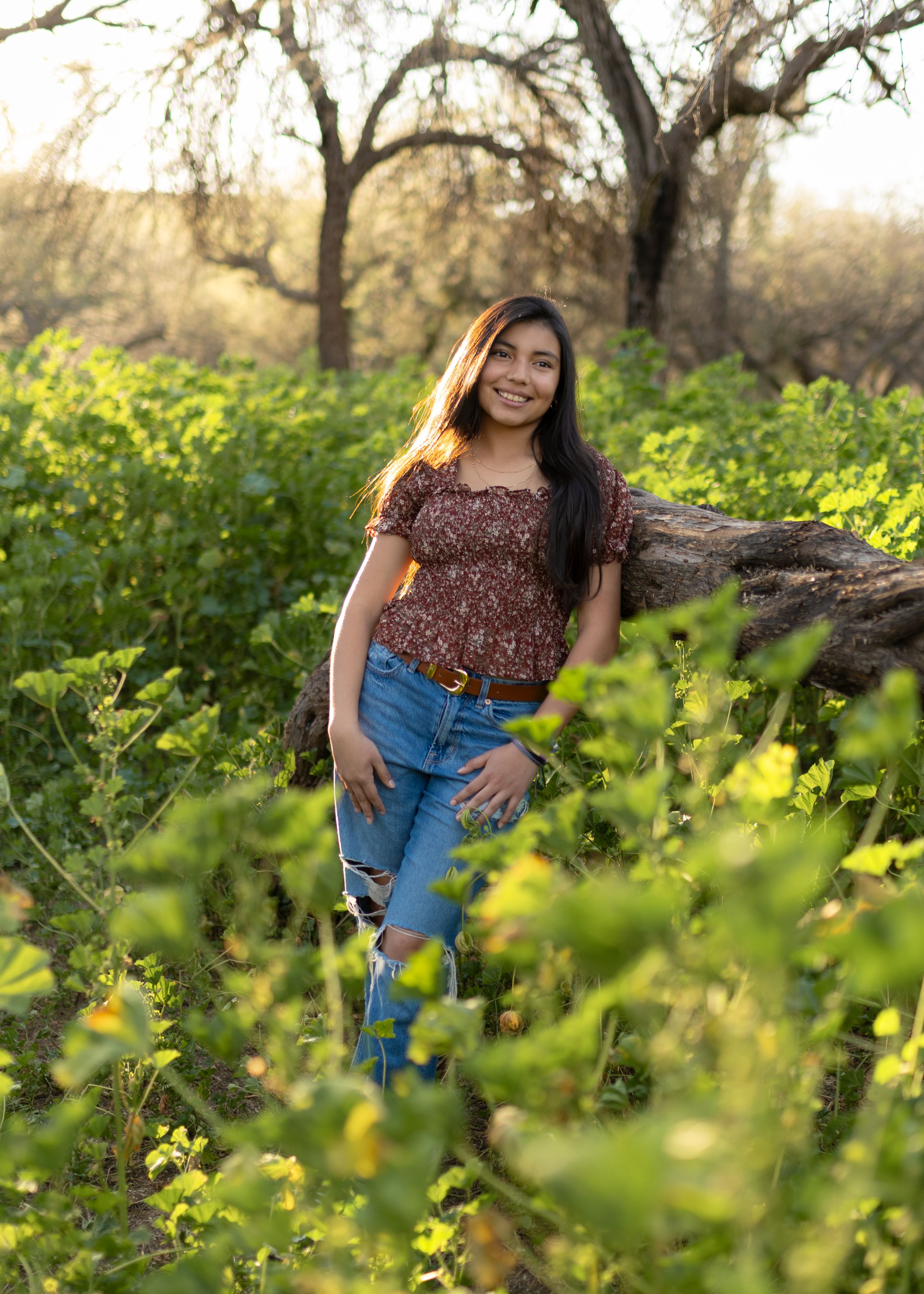 A series of outdoor portraits taken in a field of yellow wildflowers with soft natural lighting at golden hour.
