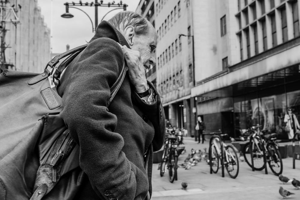 A series of black and white street photographs showing urban scenes with bikes and buildings in a city setting.