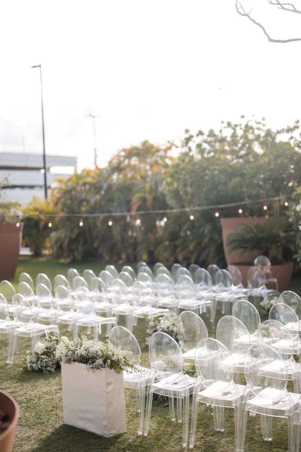 Wide view of outdoor wedding ceremony setup with chairs and floral decor in Puerto Rico
