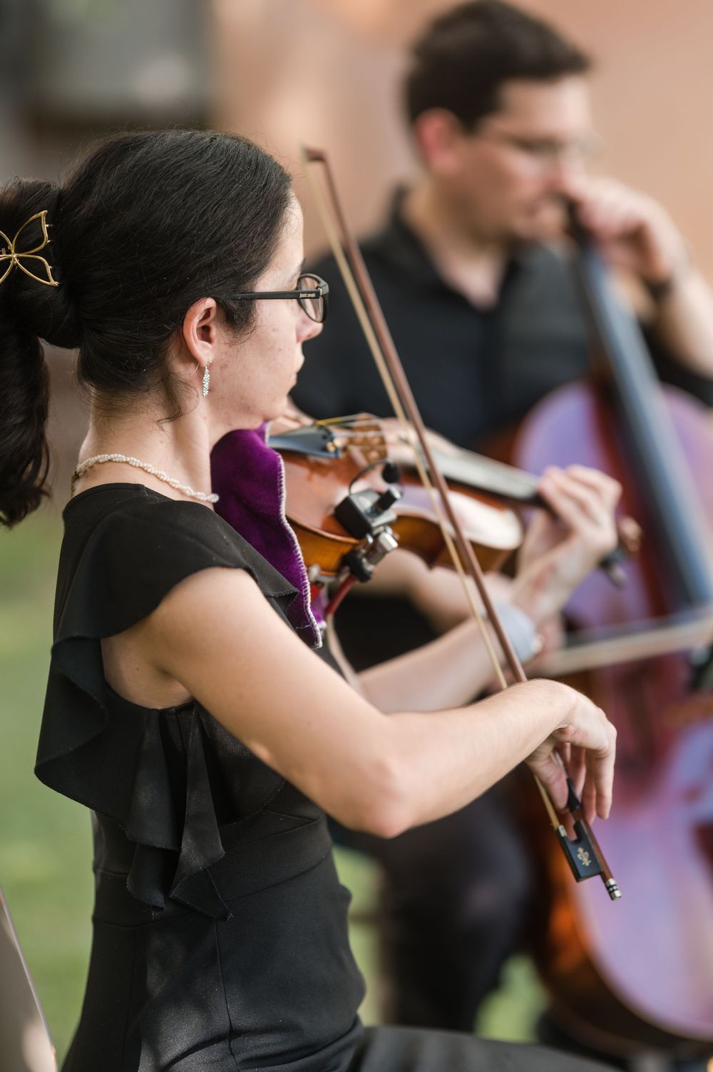 String musicians performing live during the ceremony creating an elegant and intimate atmosphere