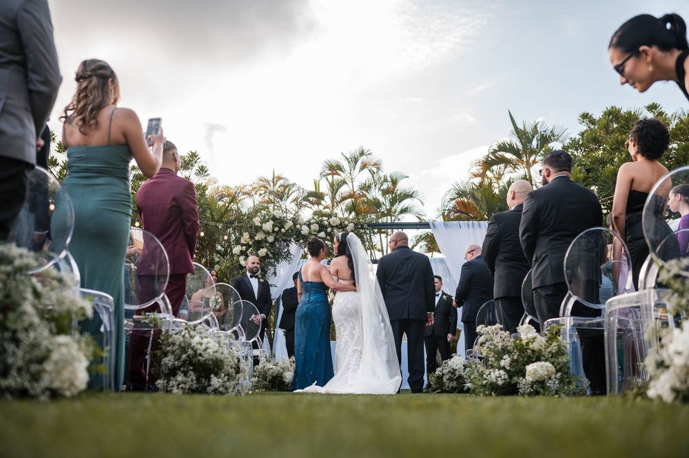 Bride walking down aisle surrounded by guests during Puerto Rico wedding ceremony
