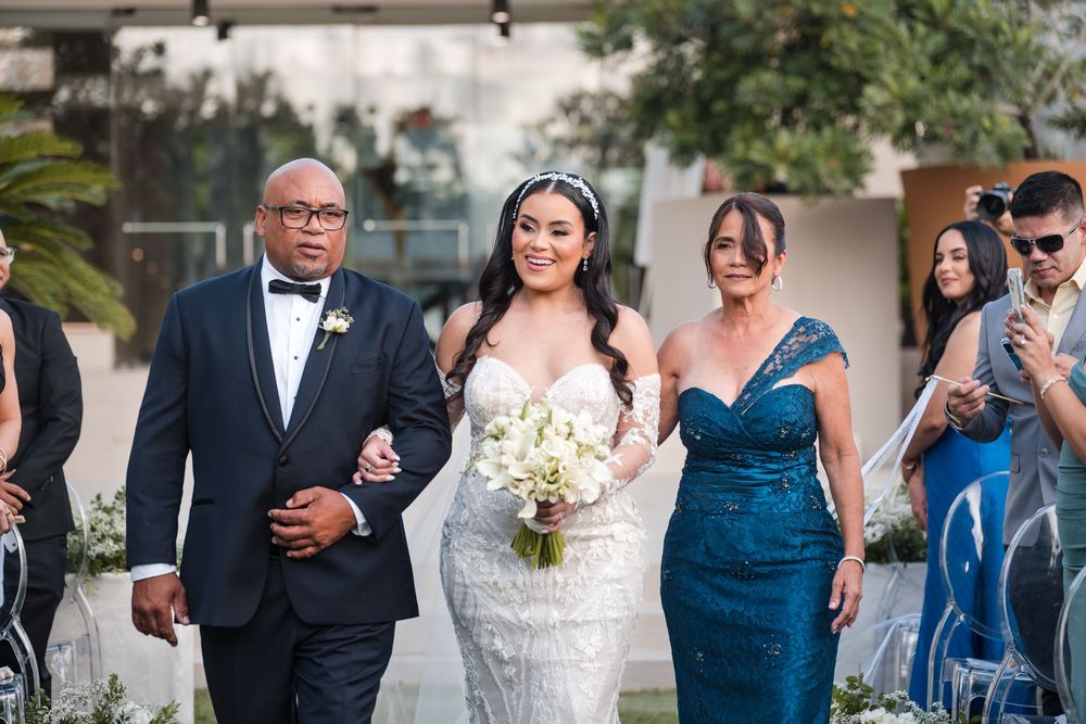 Bride walking down aisle with father during outdoor wedding ceremony in Puerto Rico