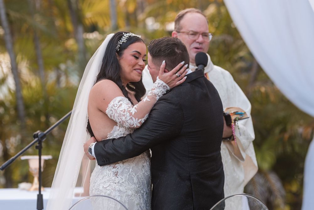 Emotional hug between bride and guest during ceremony in Puerto Rico