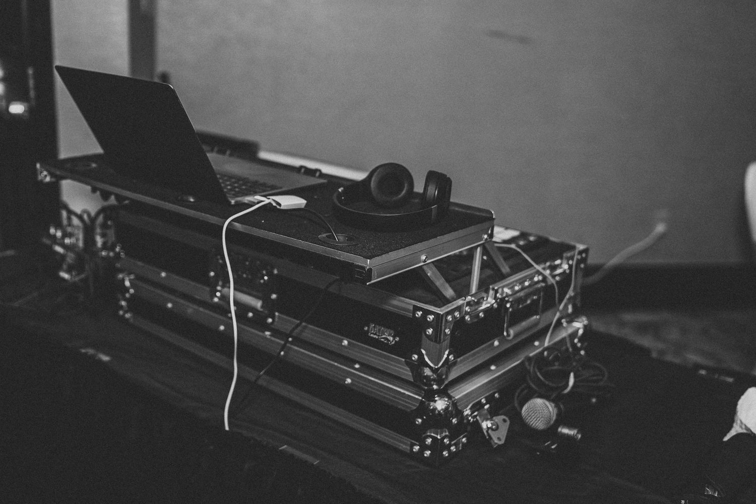 Vintage typewriters arranged in a row on display in black and white.