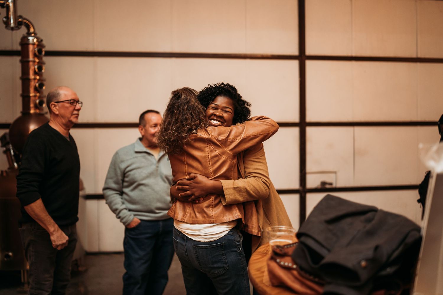 Group of people interacting in a casual indoor setting.