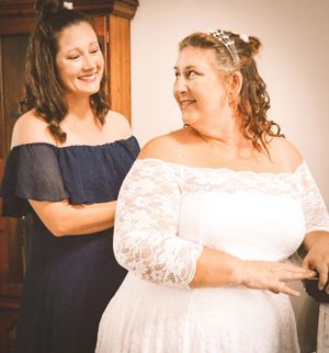 A sequence of candid getting-ready moments showing someone in navy blue assisting with a white wedding dress.