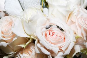 A collection of delicate blush pink roses with soft petals arranged in a romantic floral display.