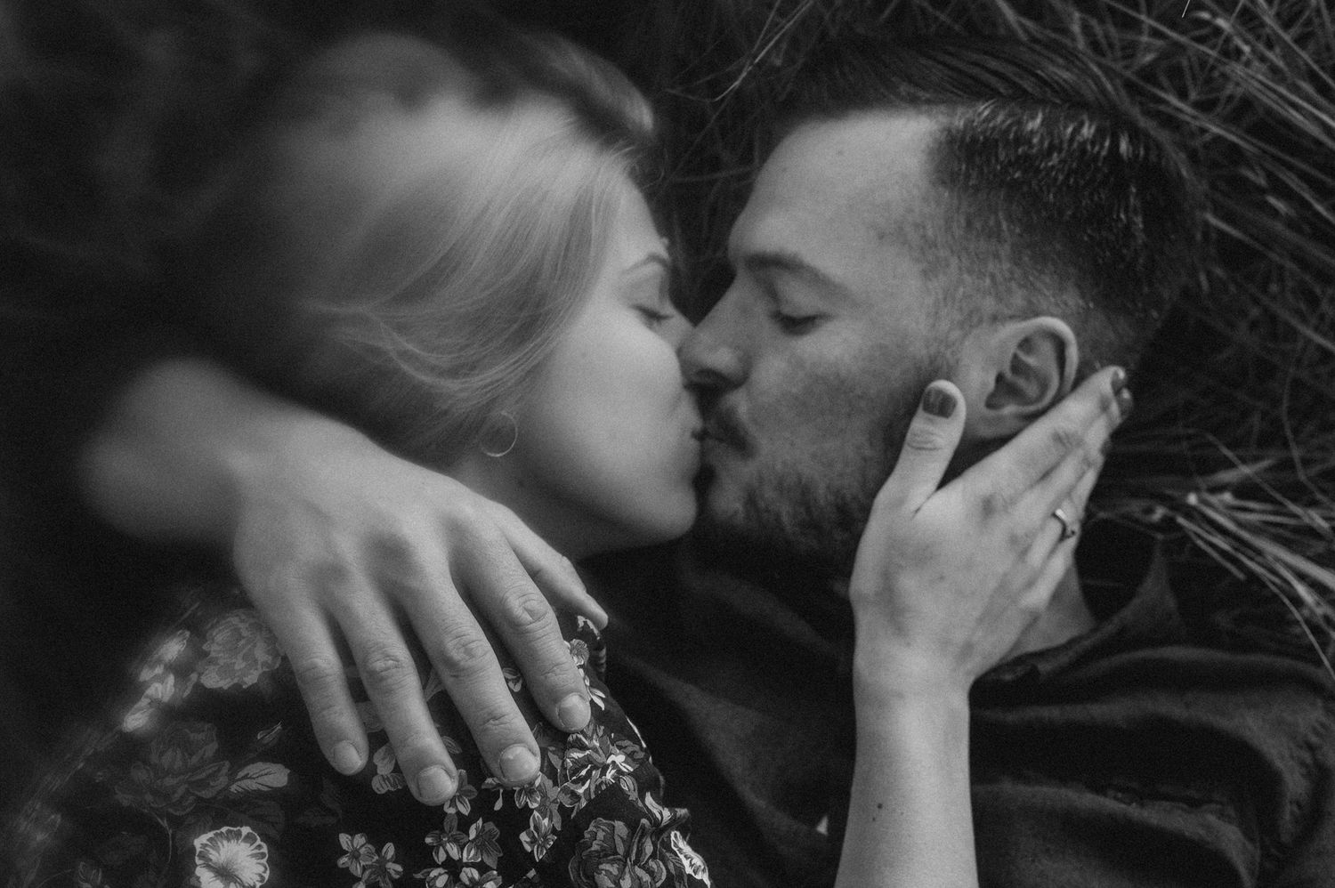 A romantic black and white photo series showing intimate moments between a couple in various poses.