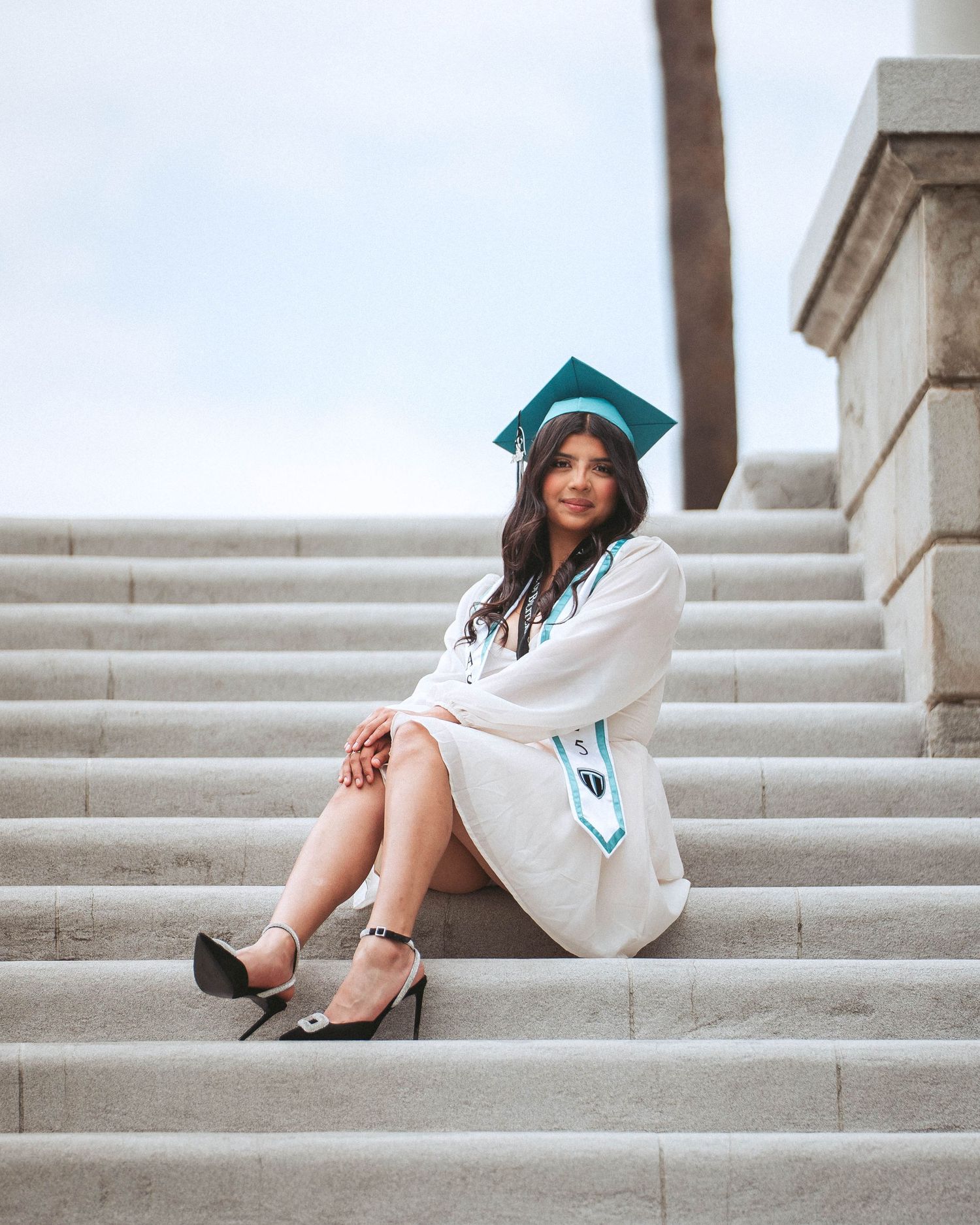 Four cropped views of white sneakers and high heels on concrete steps create a minimalist fashion composition.