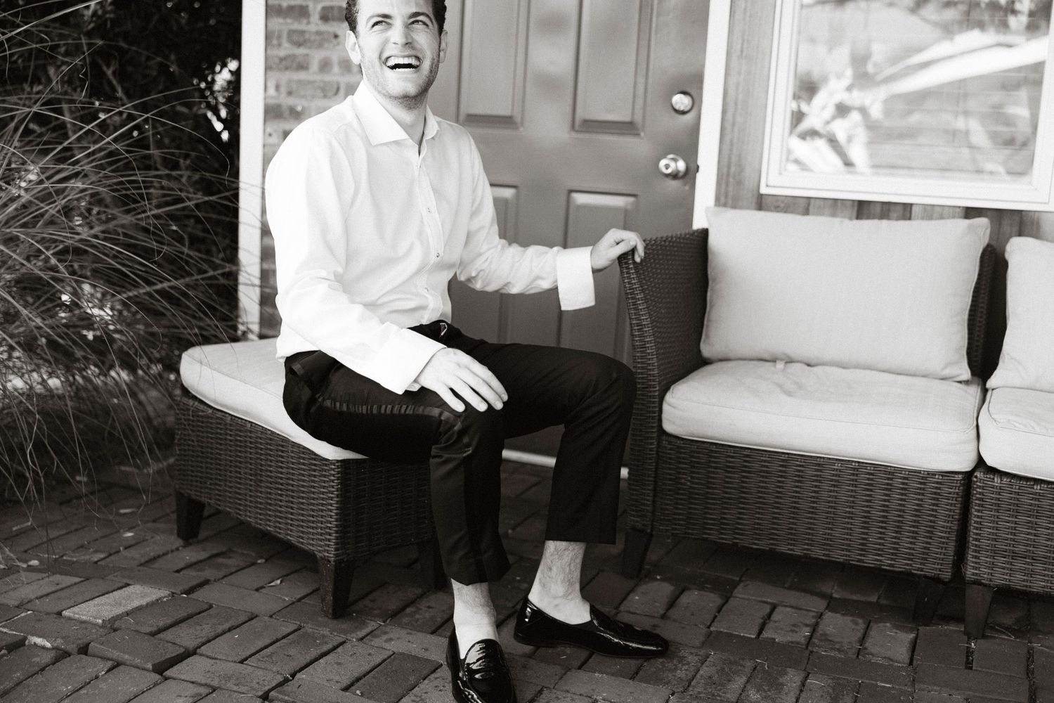 A series of black and white photographs showing a person sitting in different poses on chairs and furniture.