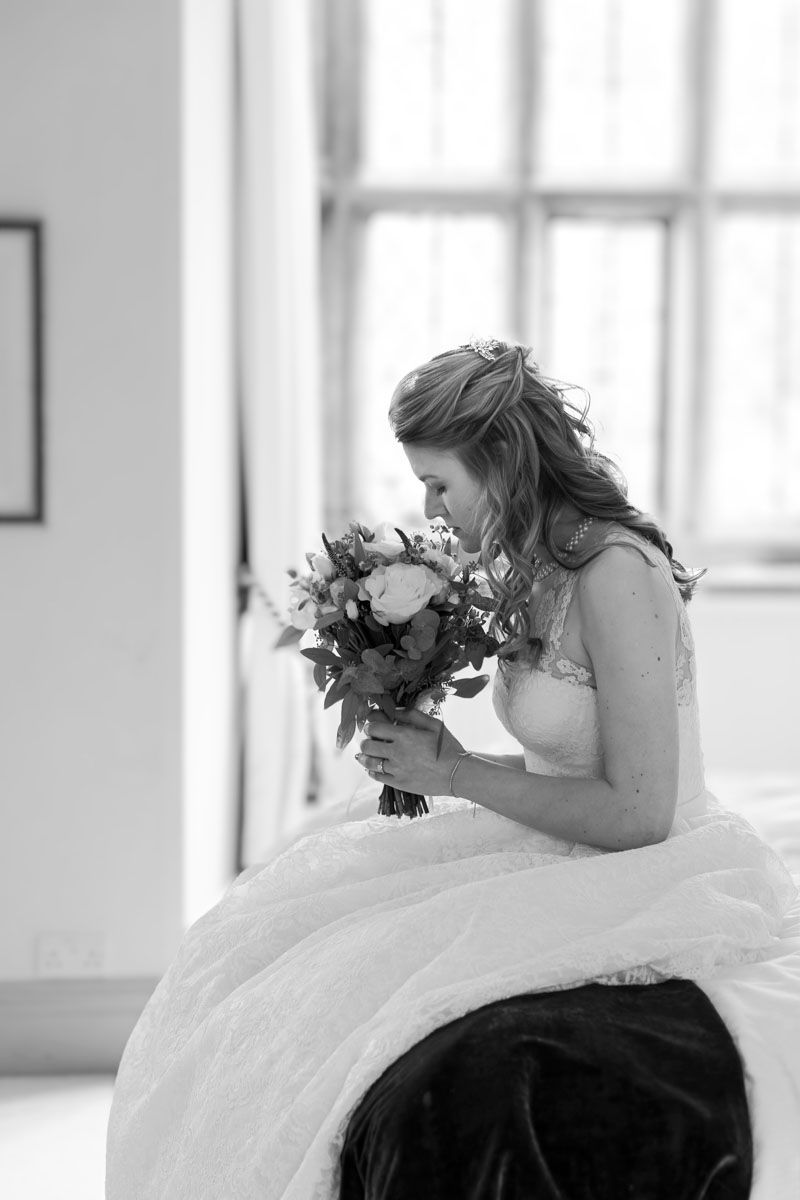 Bride elegantly poses sitting in Mansion | Smallfield Place