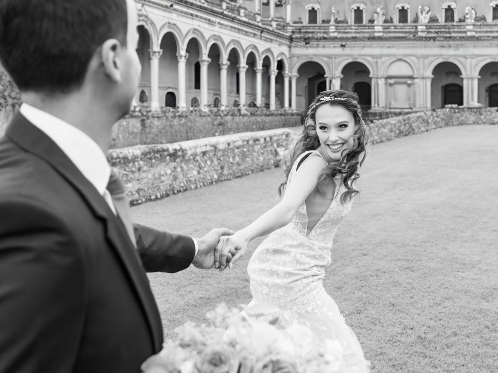 Bride and groom have a moment in abbey grounds