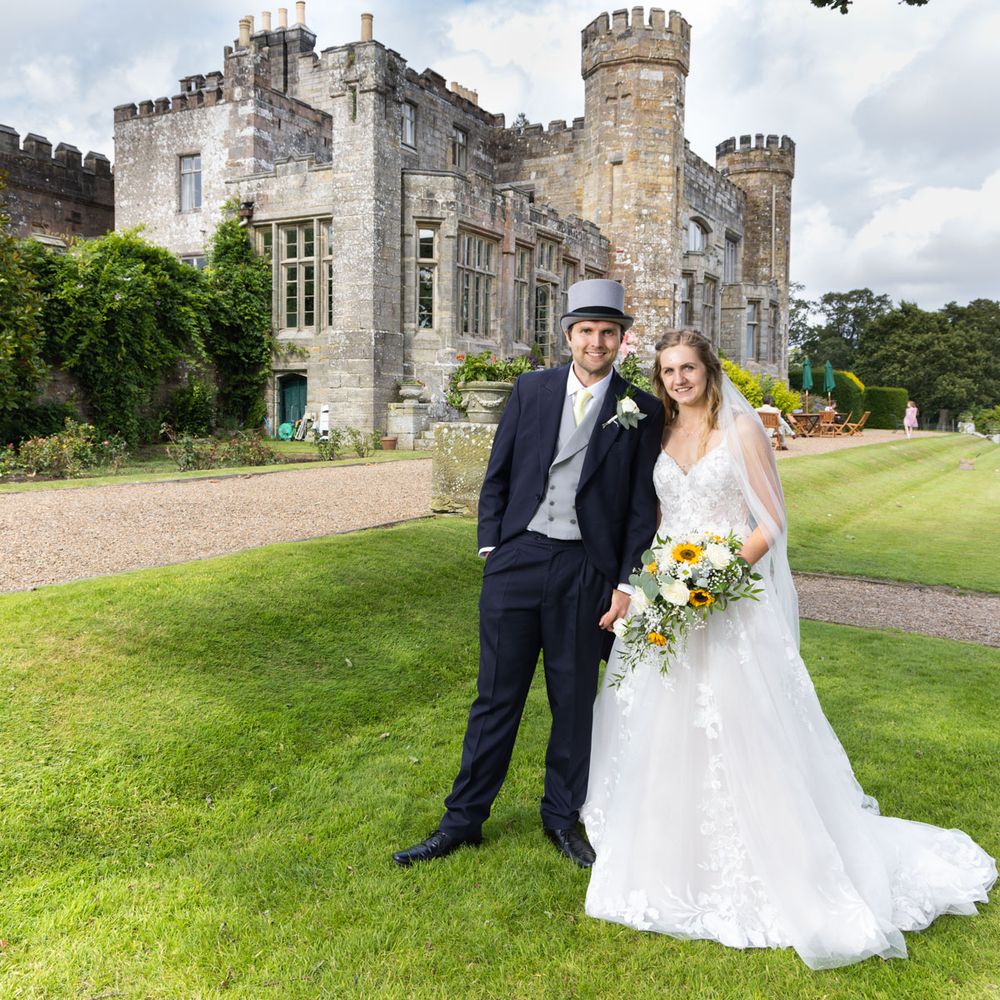 Bride and groom with Wadhurst Castle in background