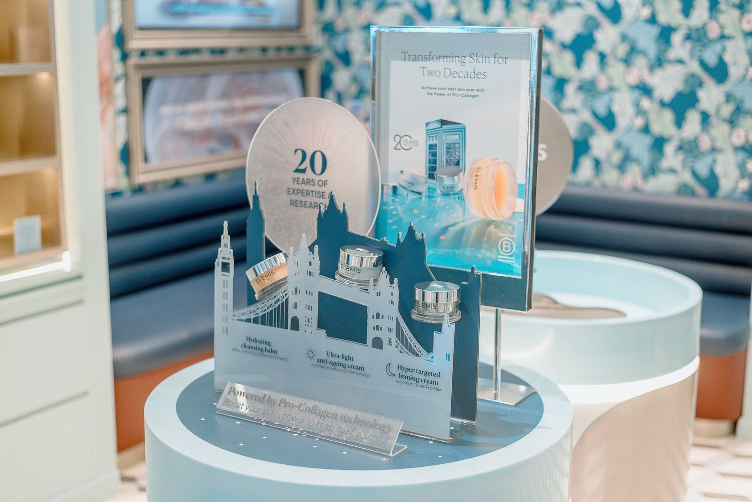 Decorative table display featuring London Bridge silhouette and teal accents with number 20 celebration theme.