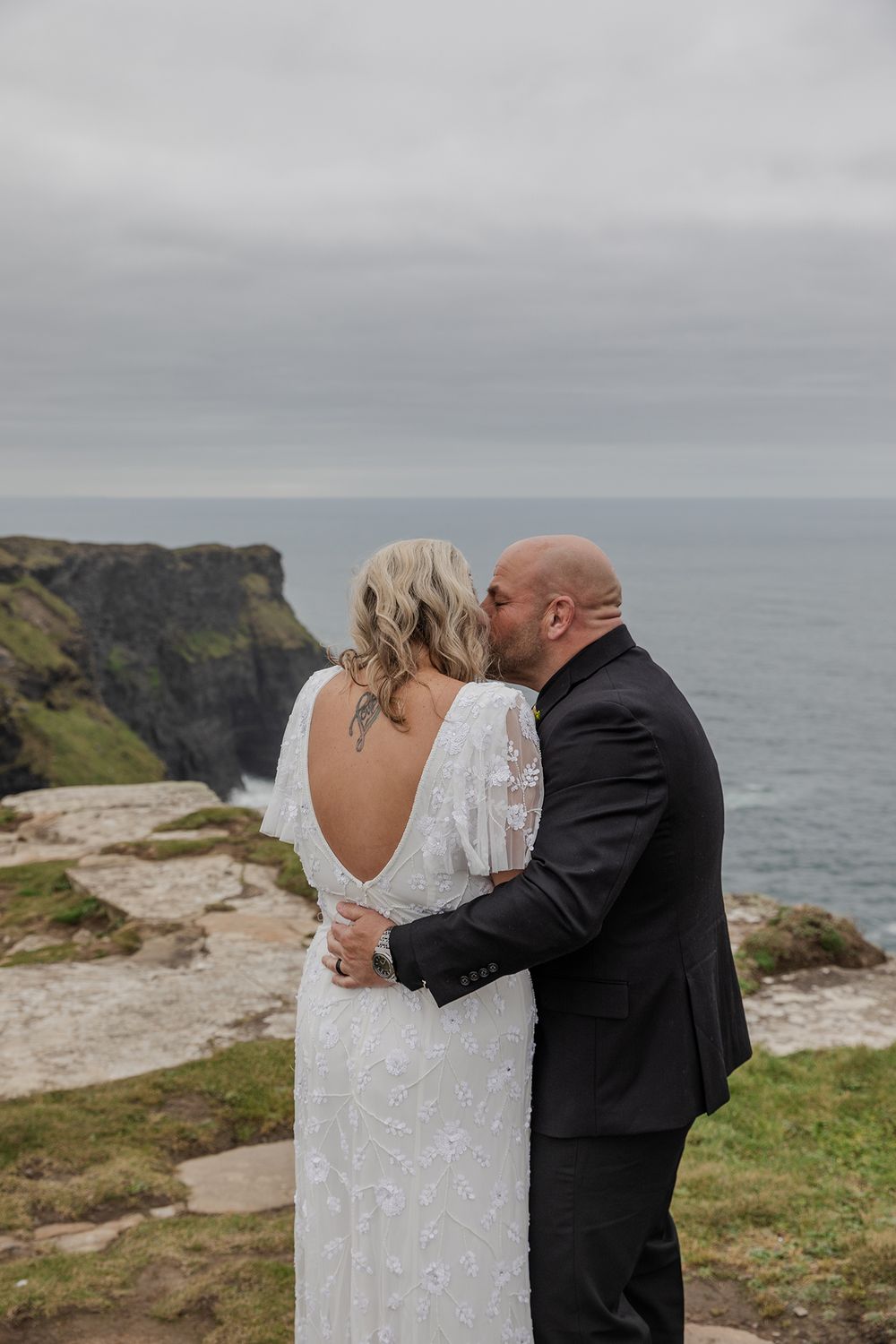 Intimate embrace in wild County Clare landscape.