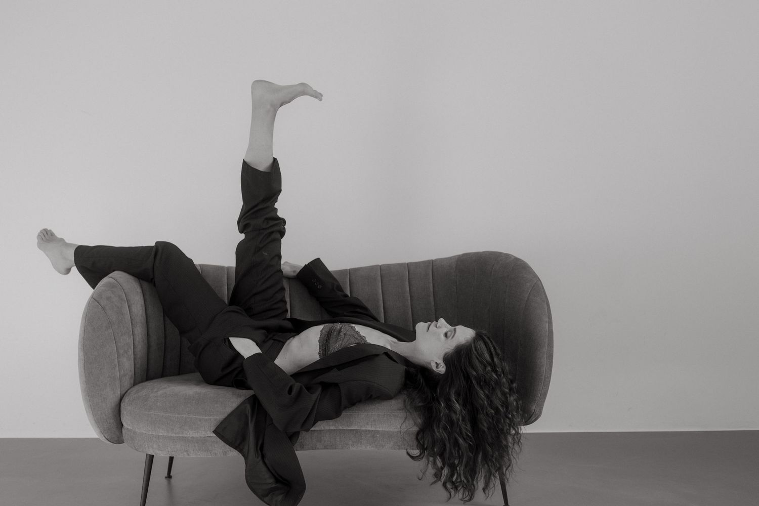 A black and white photo montage showing a person in various dance or yoga poses against a plain background.