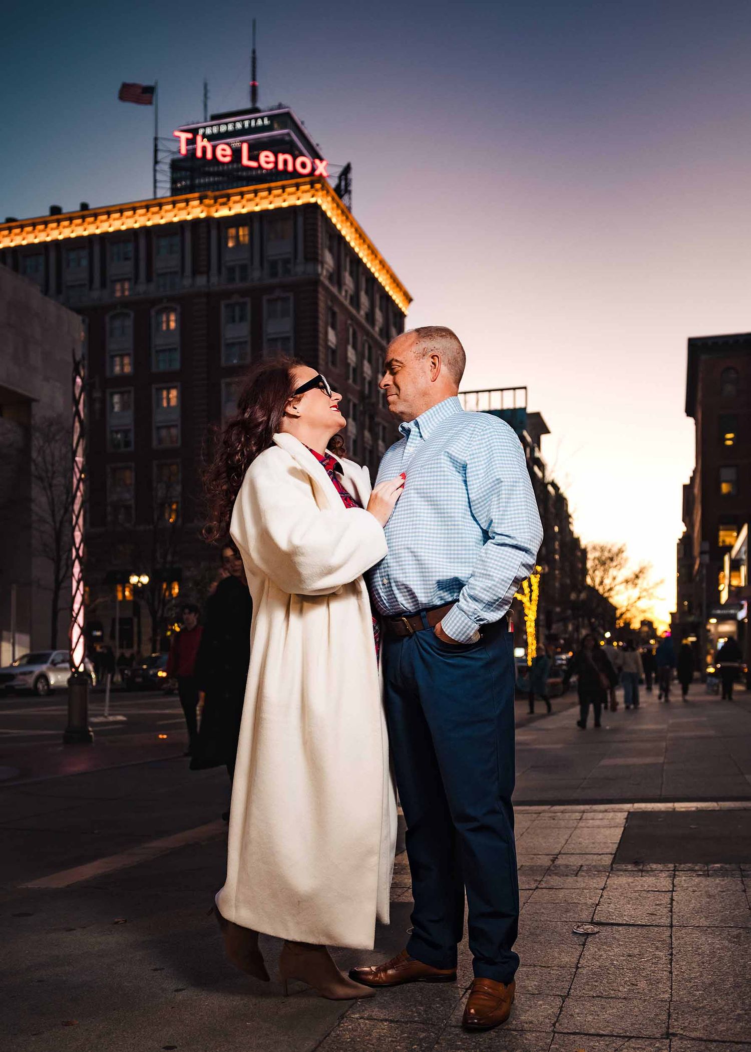 Couple portrait on Newbury Street at sunset with Lenox Hotel Boston sign in background