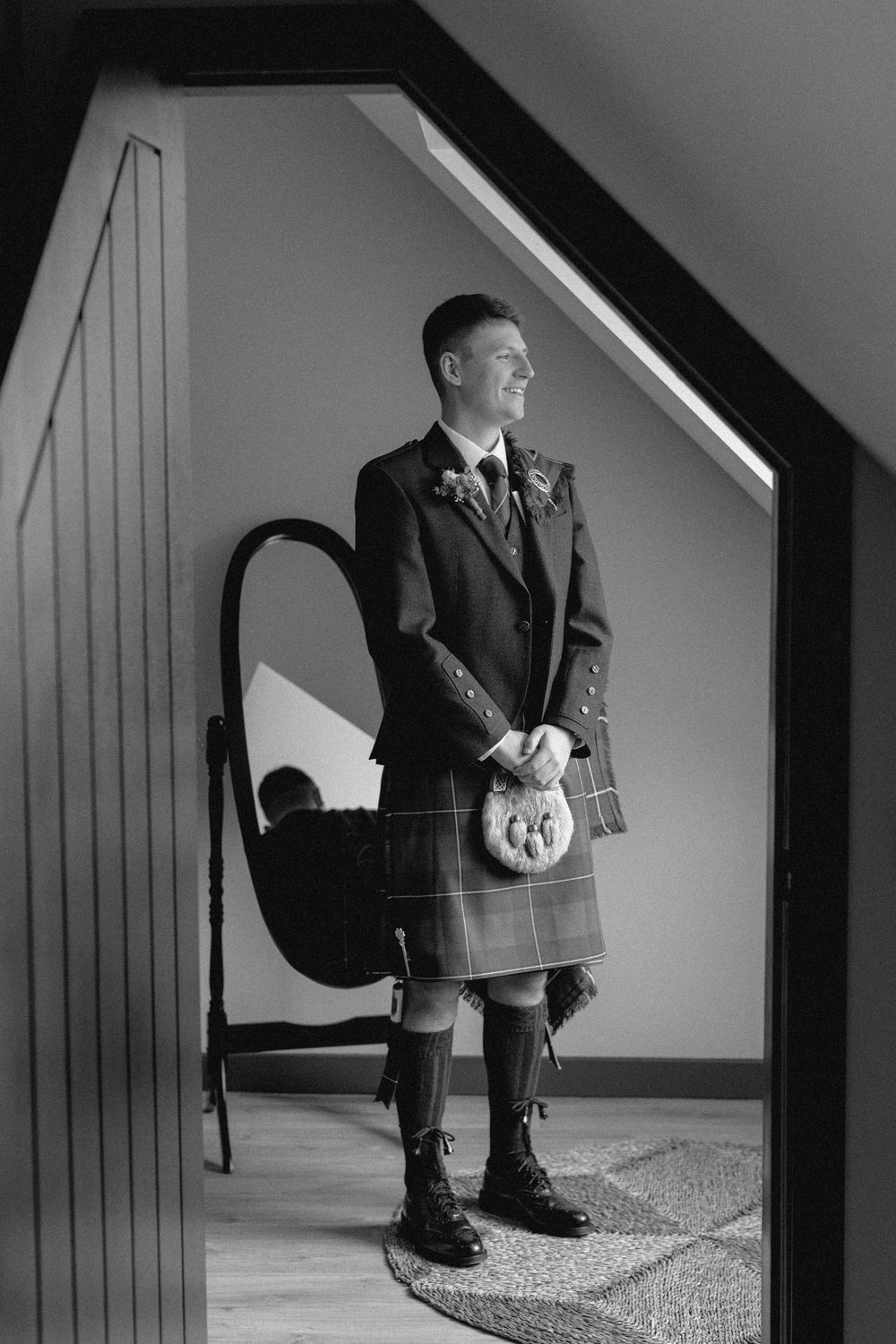 A black and white series of photographs showing a person in a suit sitting on a staircase in different positions.