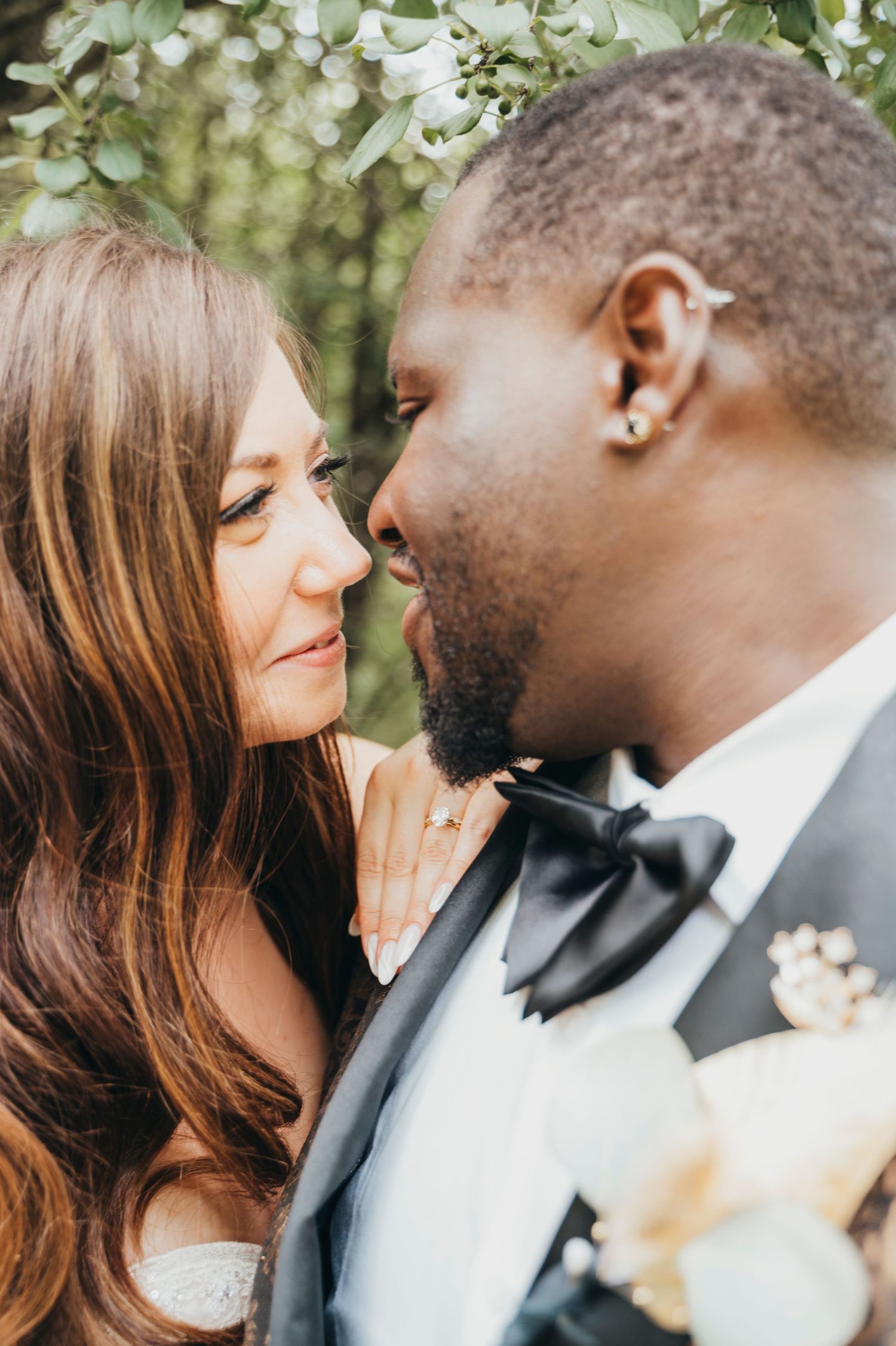 Mississauga wedding photographer captures bride  who moves in close to look at groom on their wedding day.