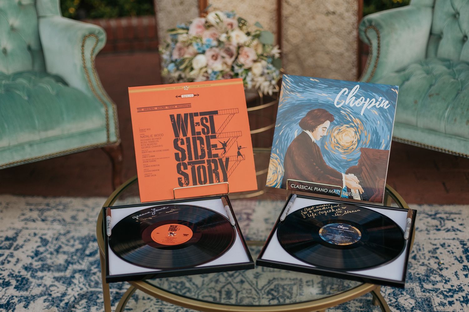 West Side Story and Chopin vinyl records displayed on a glass table at a wedding reception at Darlington House.