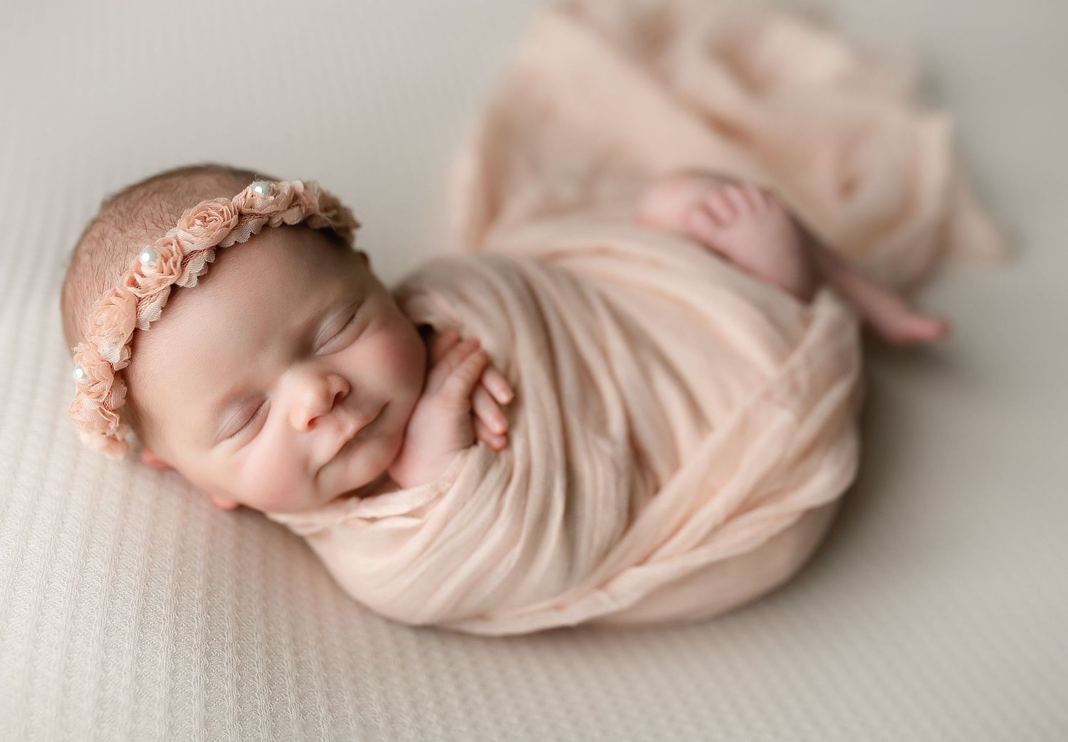 A newborn in peach wrap. Greenville sc newborn photographer, Easley sc newborn photographer, Upstate sc newborn photographer