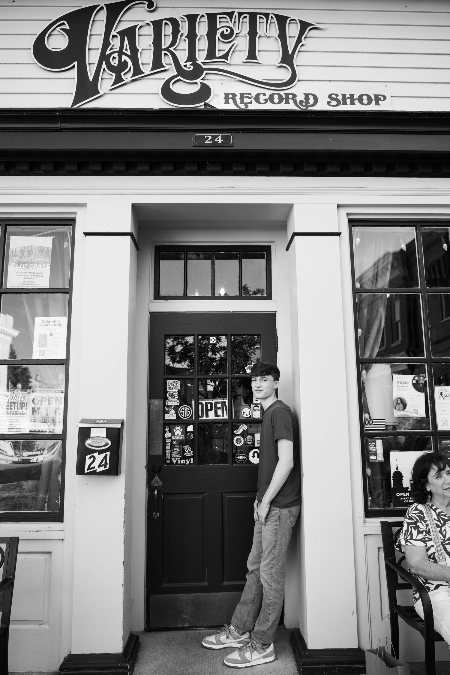 Black and white storefront images showing vintage record shop entrances with classic signage and displays.