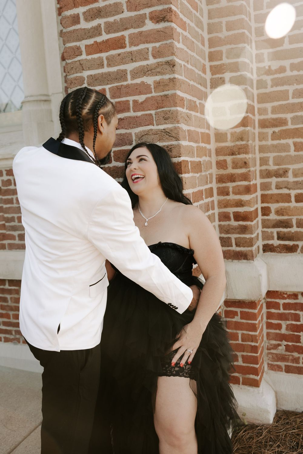A series of intimate moments captured against a rustic brick wall background.