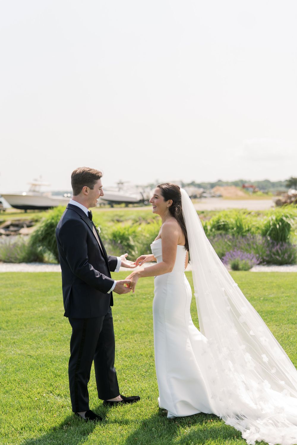 A couple shares a joyful moment during their outdoor wedding ceremony.