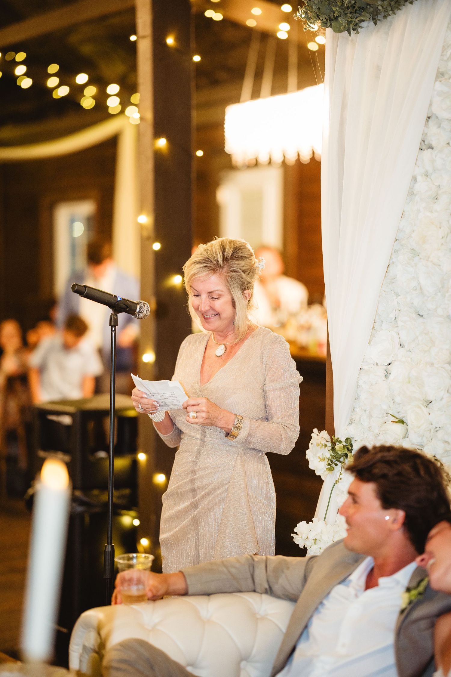 A wedding toast sequence showing a person in light-colored attire delivering a speech with varying emotional expressions.