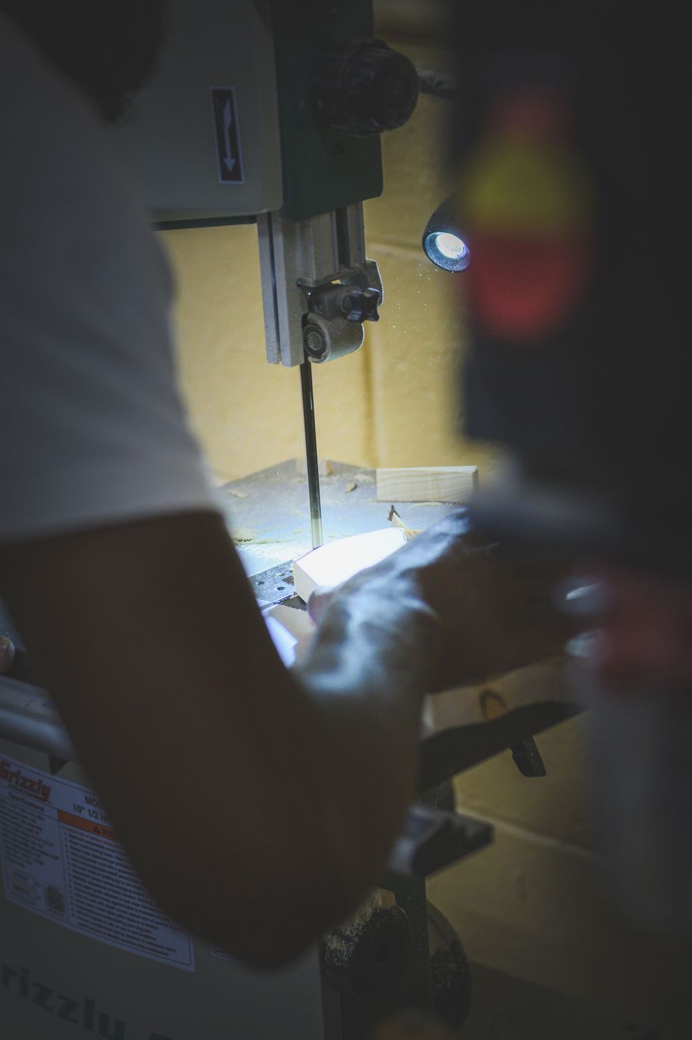 A series of dark sawing machine close-up shots showing detailed cut work