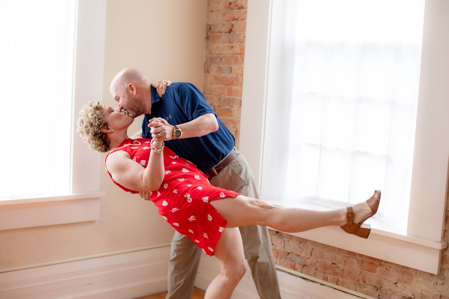 Mom and dad portrait session in Cincinnati studio highlighting elegant, high-end couple photography for premium clients