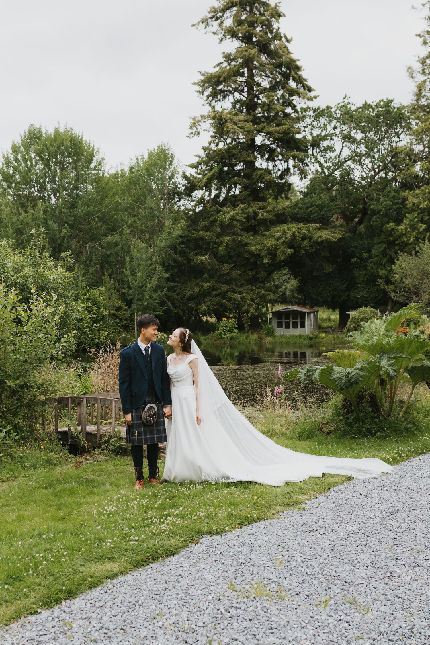 Overhead view of wedding ceremony in historic venue with stone walls and wooden floors.
