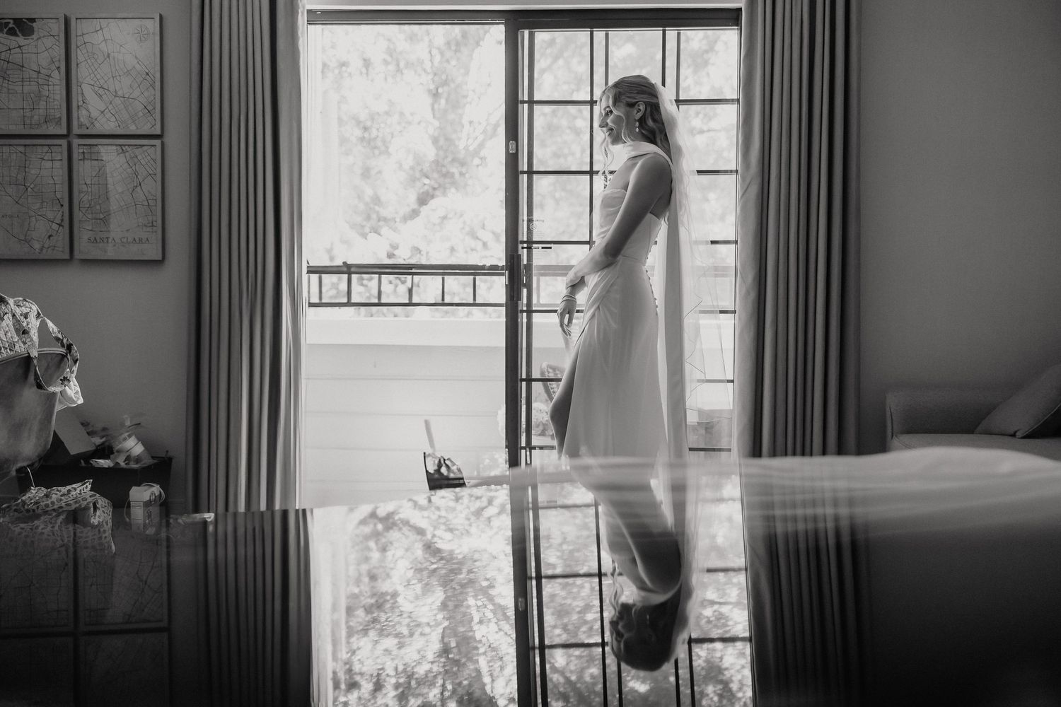 Moody black and white interior scene with dramatic window lighting.