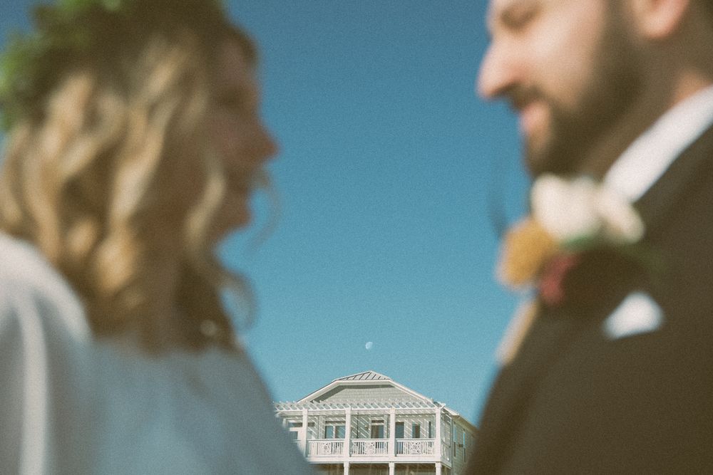 A collection of romantic wedding photos with couples against a bright blue sky and gazebo background. Wilmington, NC Wedding