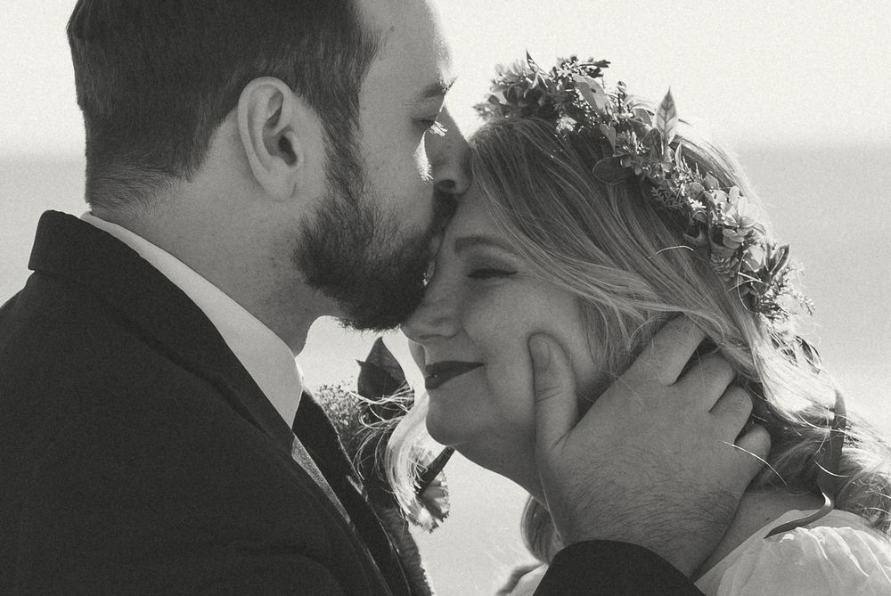 A series of romantic black and white photos showing tender moments between a couple on their wedding day. Carolina Beach, NC