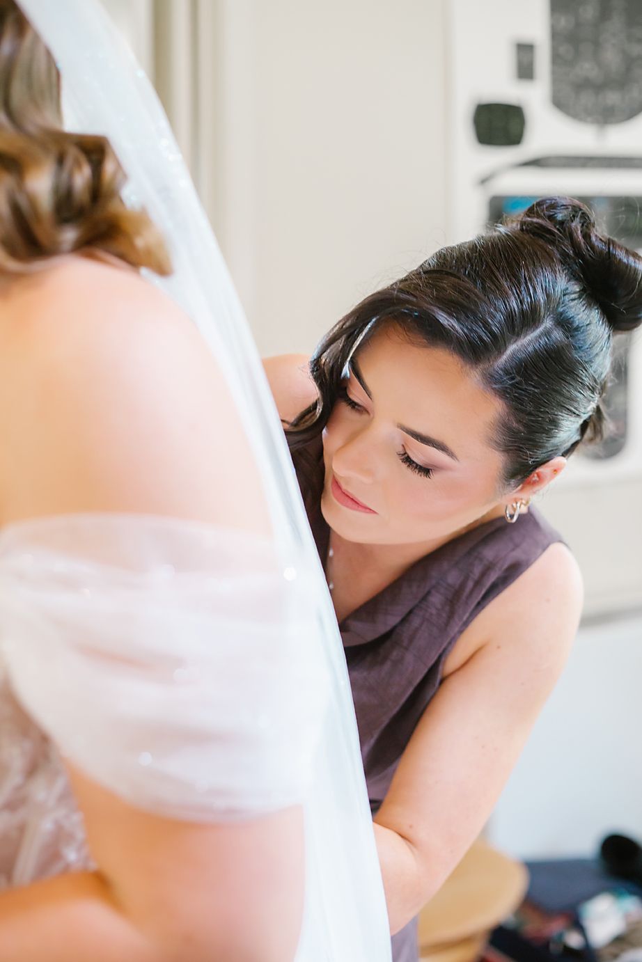 A series of artistic wedding preparation photos showing makeup application and styling in soft, natural light.
