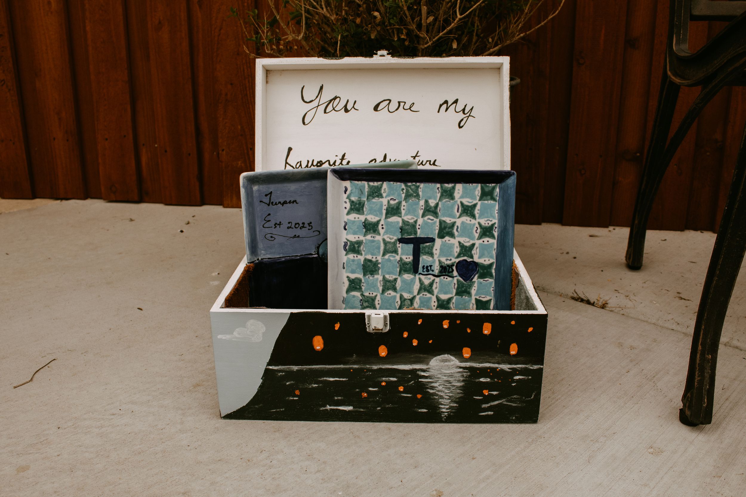 Handmade wooden box with "You are my favorite adventure" written inside lid, featuring painted night sky exterior.