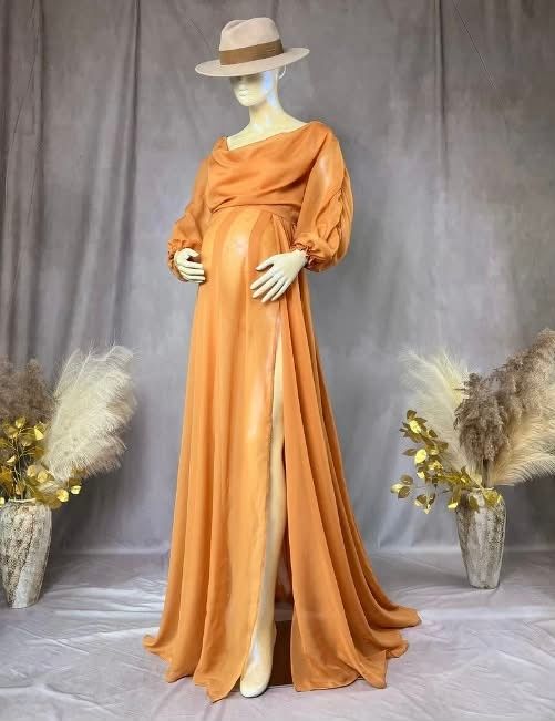 Flowing burnt orange maternity gown with empire waist and draped sleeves shown in multiple angles against gray backdrop.