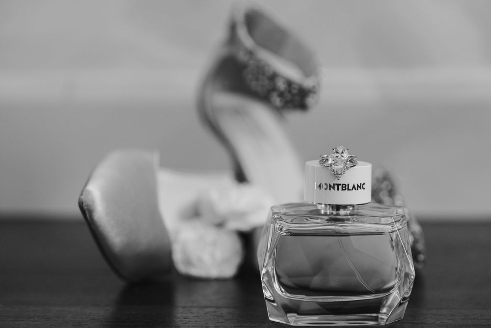 A series of black and white close-up photographs showing delicate water droplets on various surfaces.