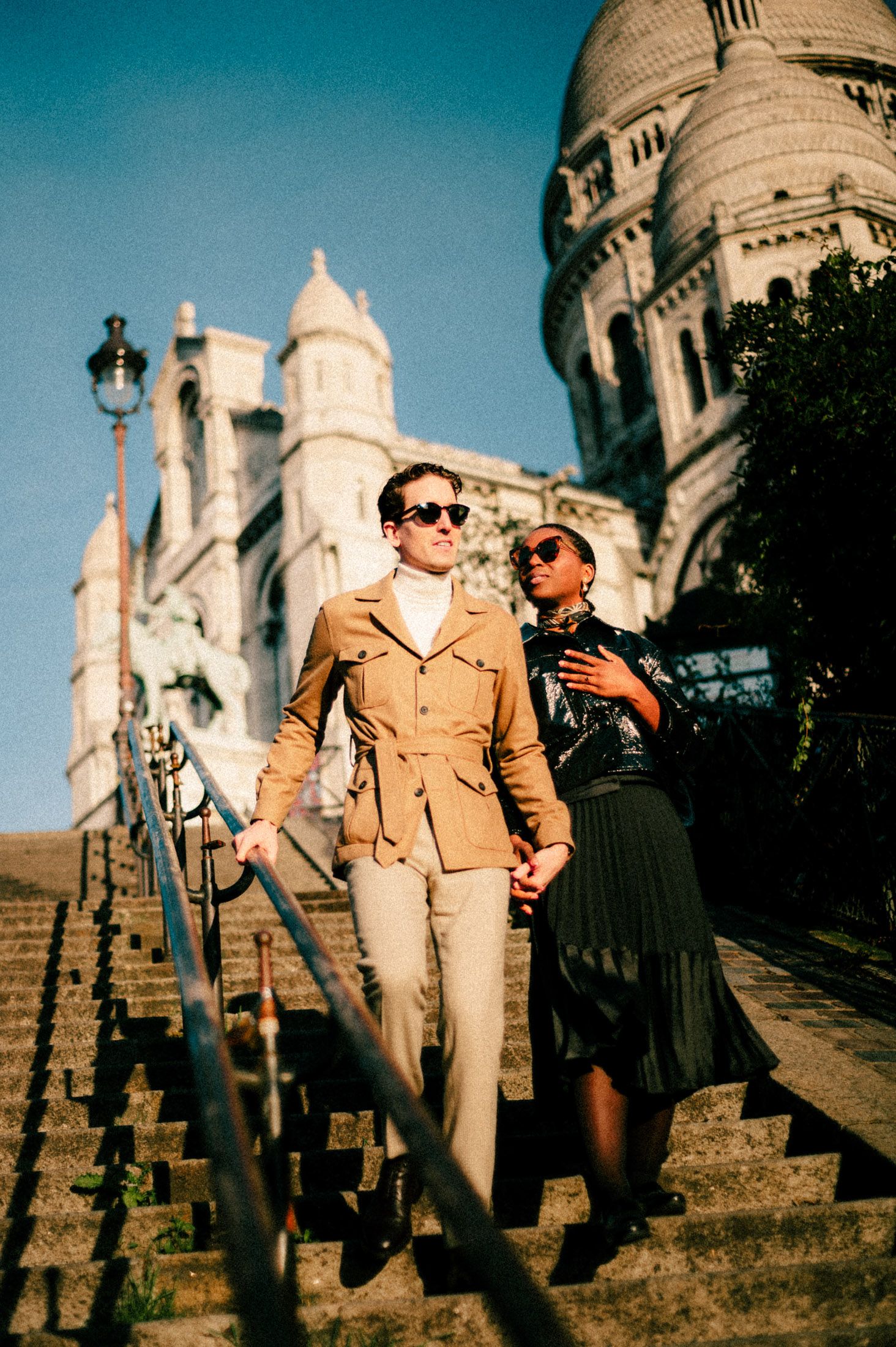 The iconic white domes and architecture of Sacre-Coeur Basilica in Paris captured in a panoramic series of photos.