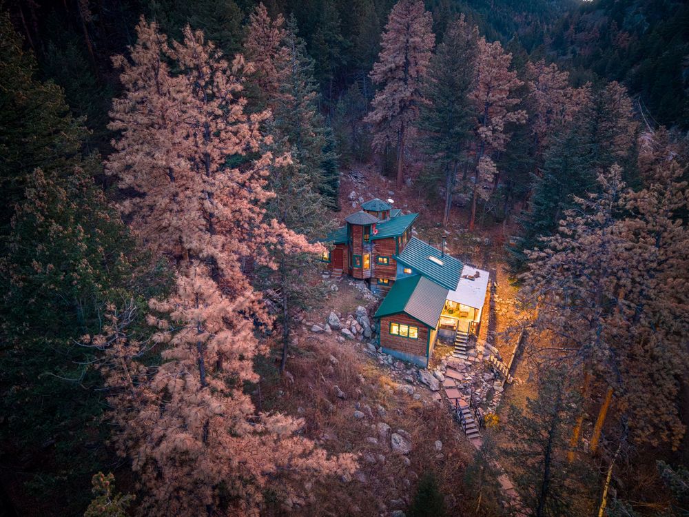 Aerial/drone photo of a glowing Prospector's Pine by Denver Hospitality, Travel & Tourism photographer Captain Colorado Photography.