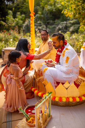 A sequence of photos showing a couple enjoying an intimate moment at a colorful outdoor celebration.