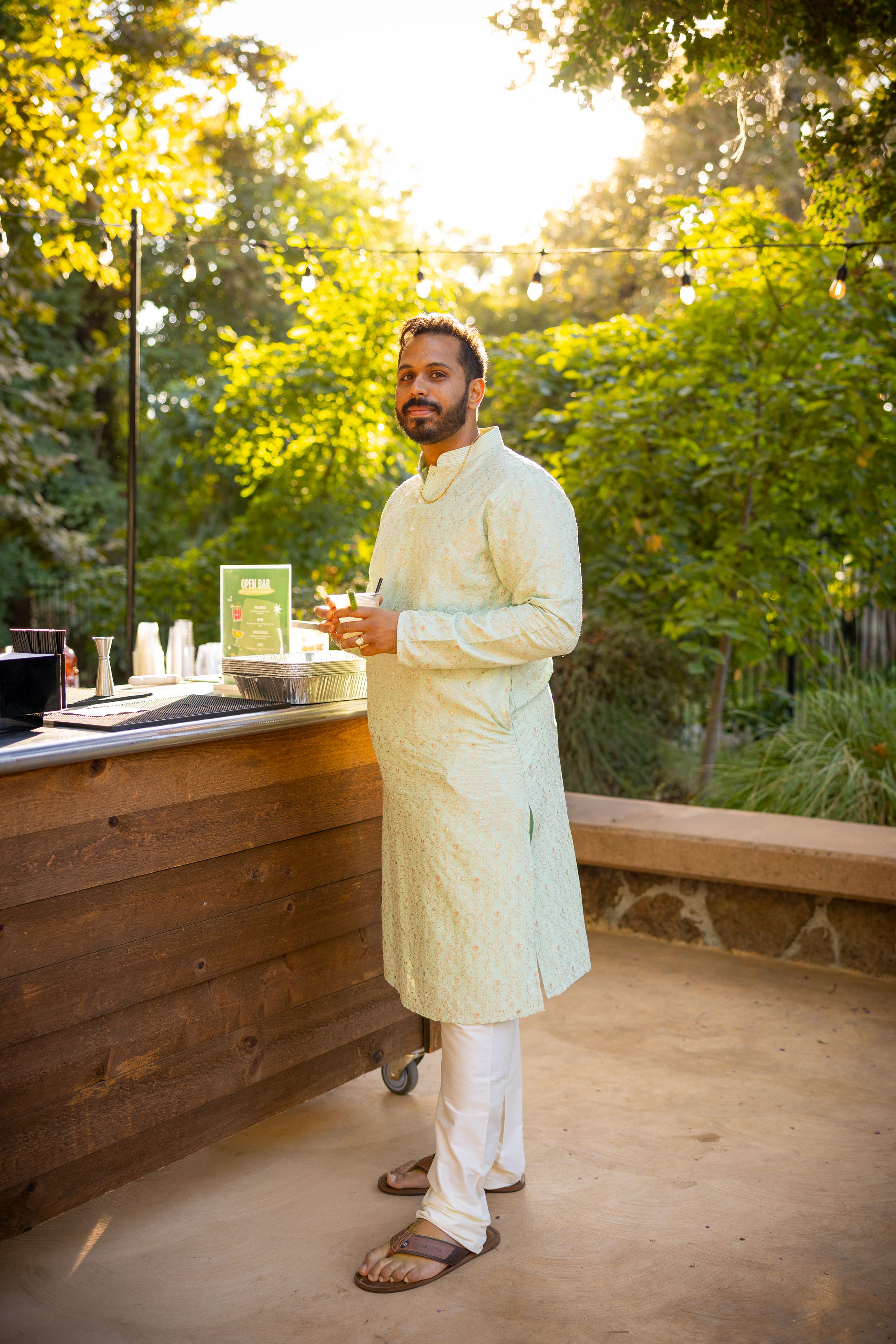 A series of outdoor bar service photos showing drinks being prepared on a wooden deck at sunset.