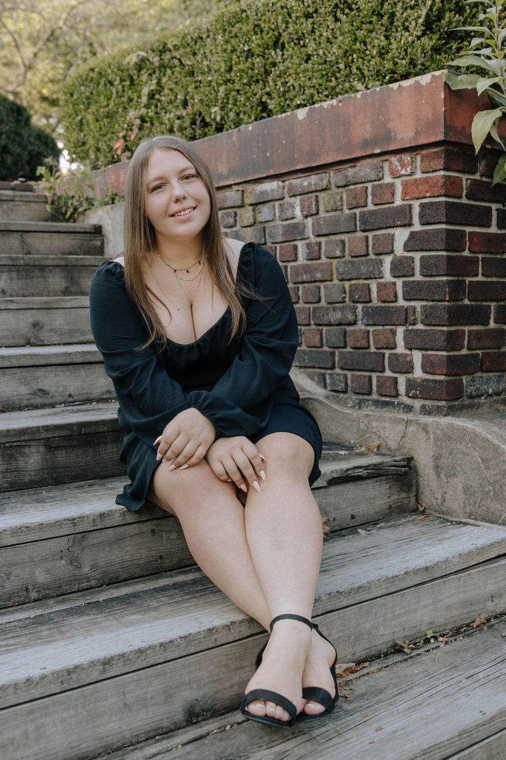 Candid lifestyle photography on rustic steps with architectural elements.