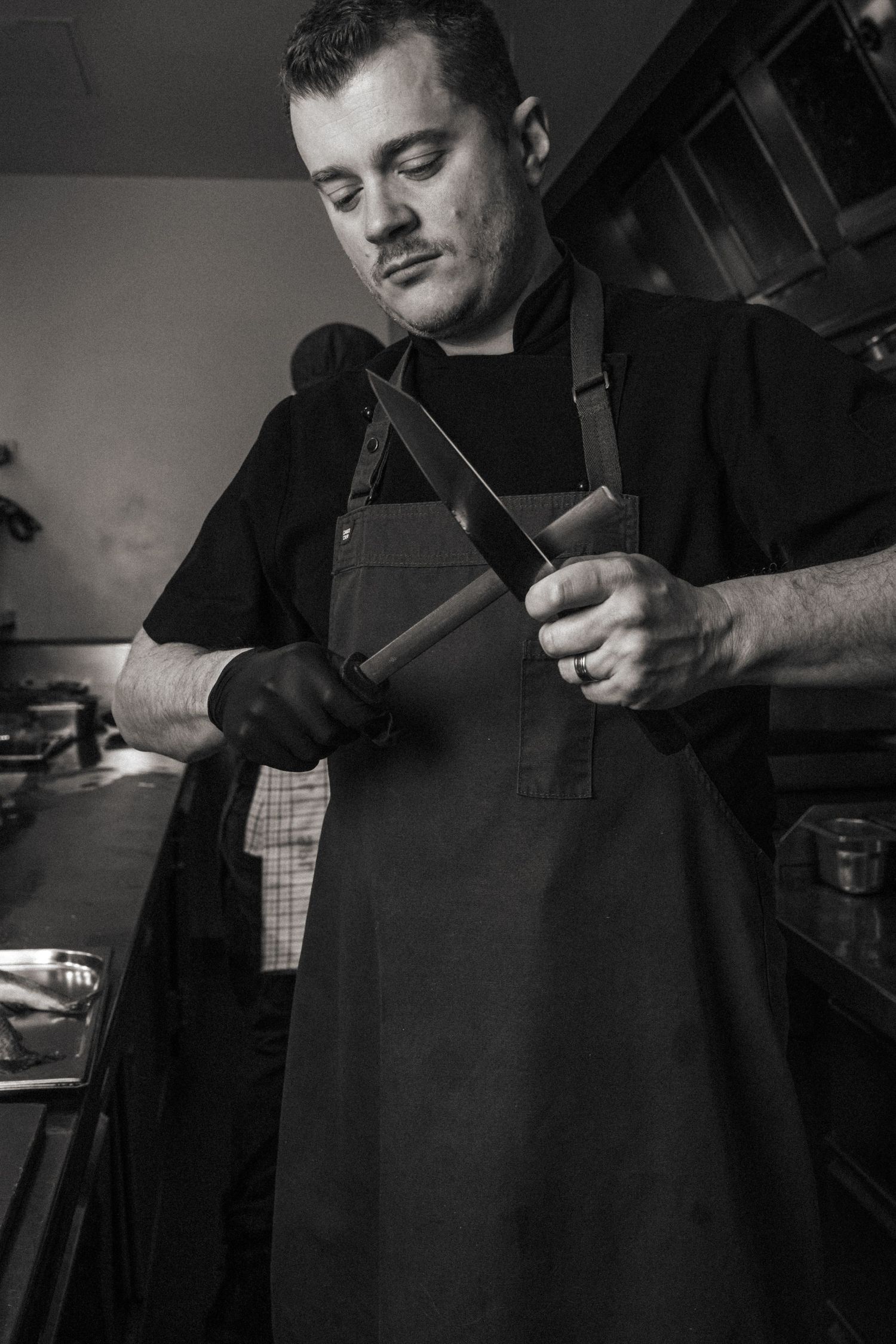 Chef portrait photography showcasing hospitality team and behind-the-scenes restaurant preparation